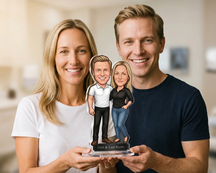 A couple holding their custom figurine — a personalized gift